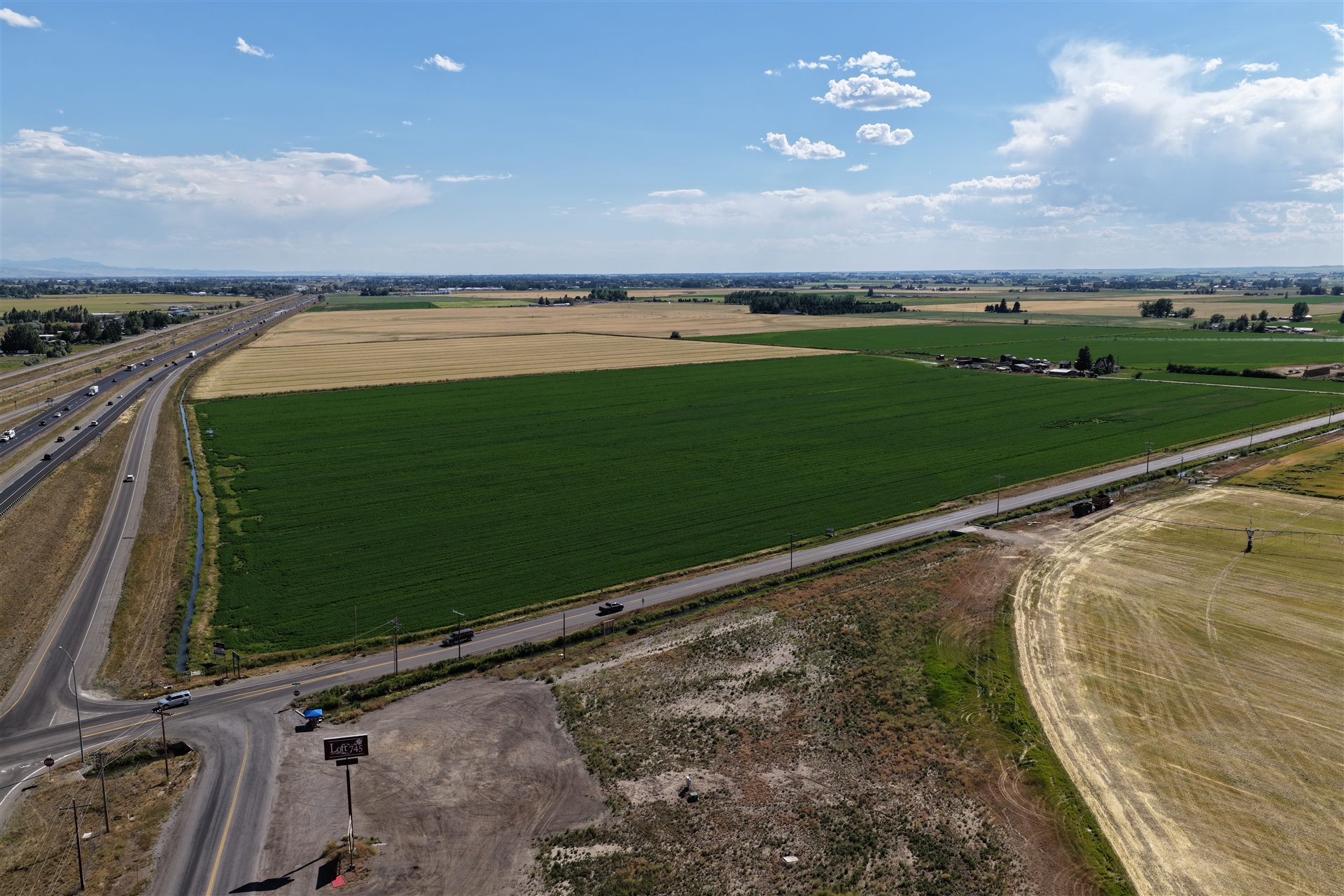 Aerial over East Idaho farmland and roads